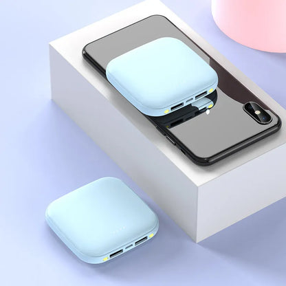 Mini power bank with 20000mAh capacity, compact black design, LED flashlight, and USB port for charging devices