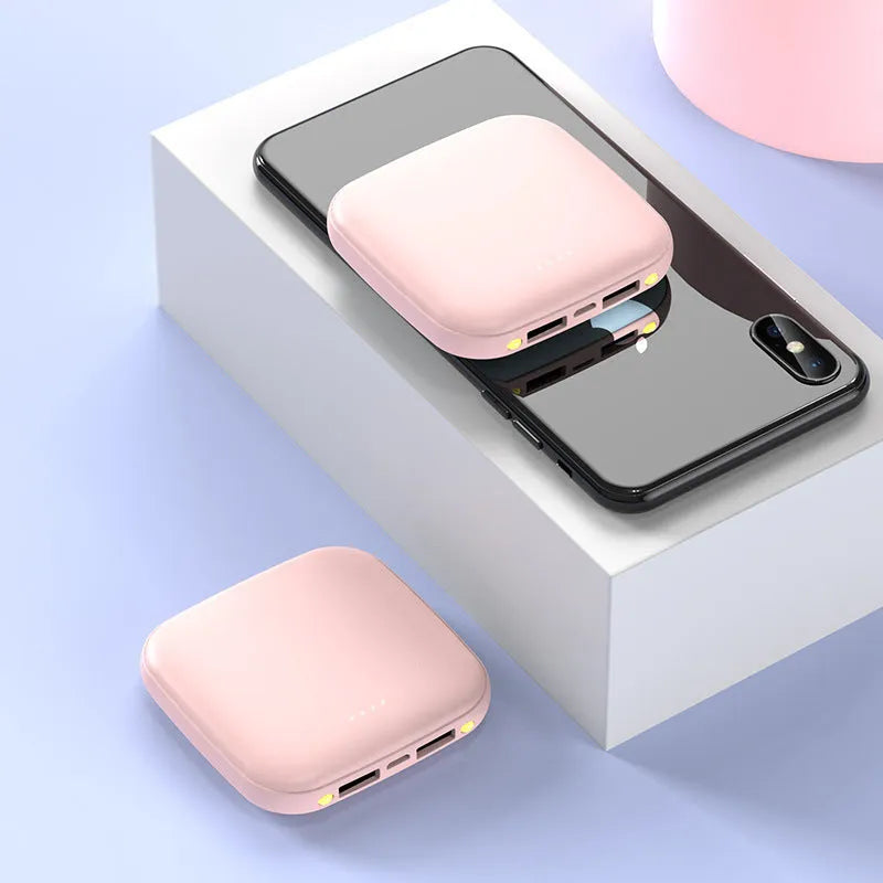Mini power bank with 20000mAh capacity, compact black design, LED flashlight, and USB port for charging devices