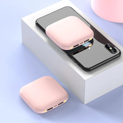 Mini power bank with 20000mAh capacity, compact black design, LED flashlight, and USB port for charging devices