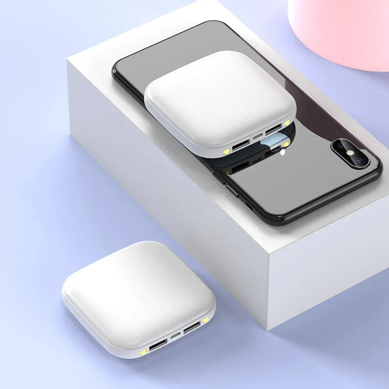 Mini power bank with 20000mAh capacity, compact black design, LED flashlight, and USB port for charging devices