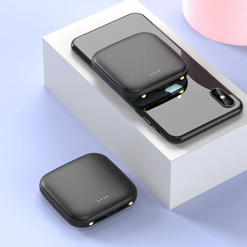 Mini power bank with 20000mAh capacity, compact black design, LED flashlight, and USB port for charging devices