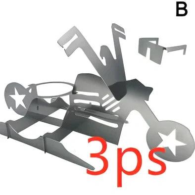 Steel motorcycle-shaped chicken roasting rack holding upright chicken with beer can on barbecue grill