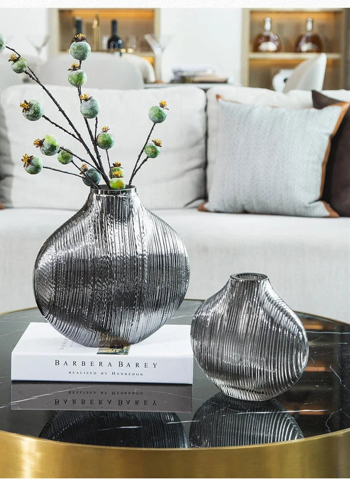Silver brushed electroplated glass vase showing brushed texture and glass transparency at opening
