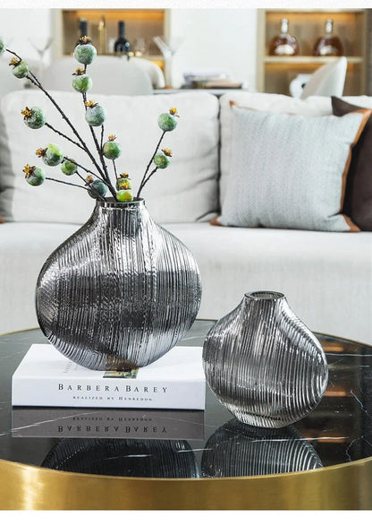 Silver brushed electroplated glass vase showing brushed texture and glass transparency at opening