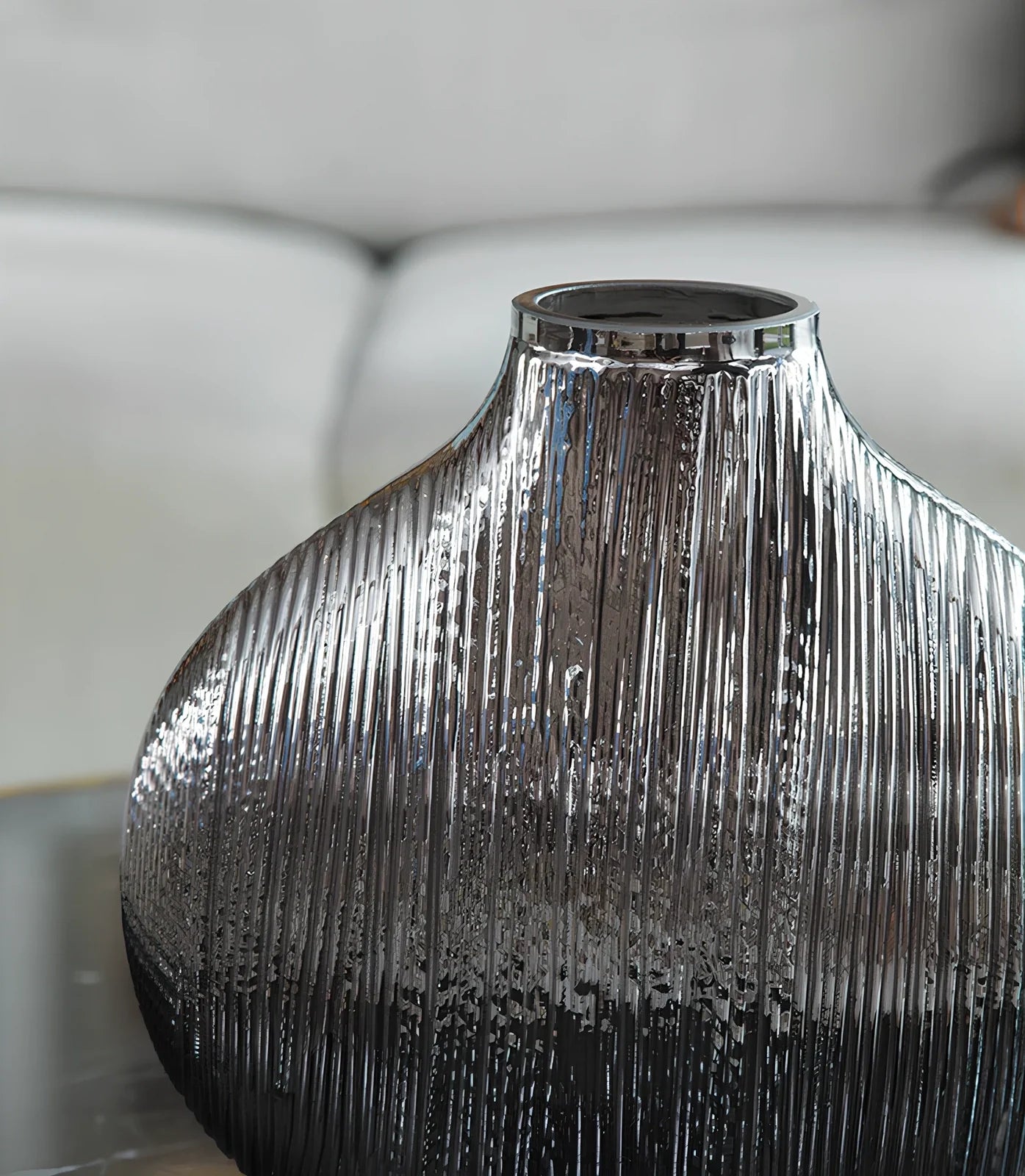 Silver brushed electroplated glass vase showing brushed texture and glass transparency at opening