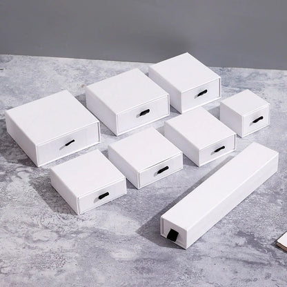 Luxury jewelry storage box with pull-out drawers for necklaces, bracelets, rings, and earrings