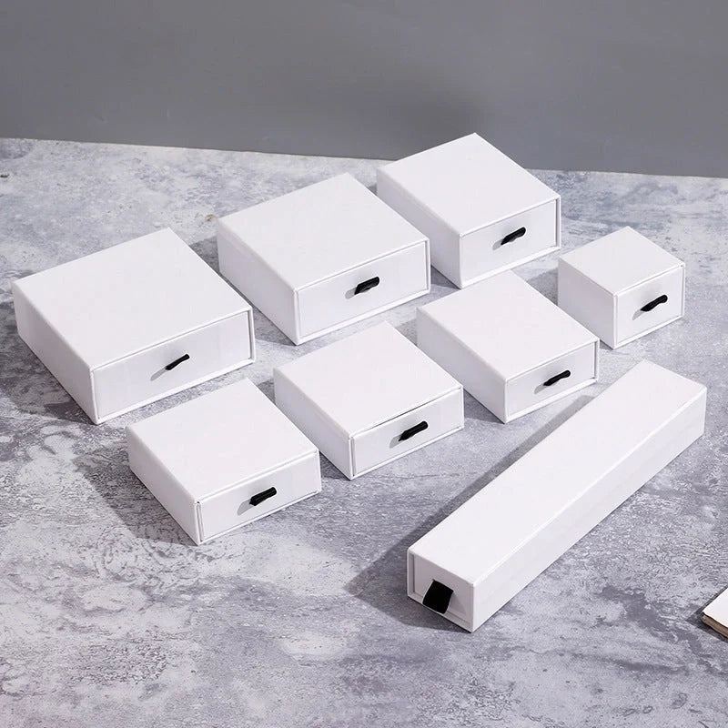 Luxury jewelry storage box with pull-out drawers for necklaces, bracelets, rings, and earrings