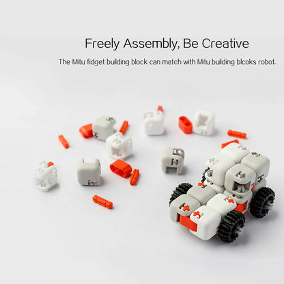 Mitu fidget building block toy in white, gray, and orange with zero draft technology for stress relief