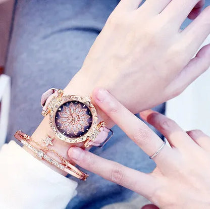 Diamond bezel women's fashion watch with round dial on wrist, showing colour options of red, purple, green, blue, black, pink, beige, grey, and brown.