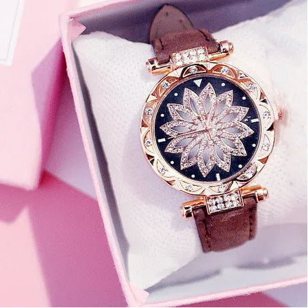 Diamond bezel women's fashion watch with round dial on wrist, showing colour options of red, purple, green, blue, black, pink, beige, grey, and brown.