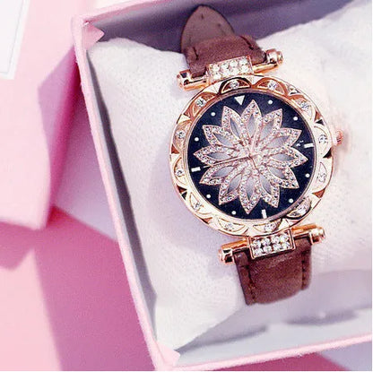 Diamond bezel women's fashion watch with round dial on wrist, showing colour options of red, purple, green, blue, black, pink, beige, grey, and brown.