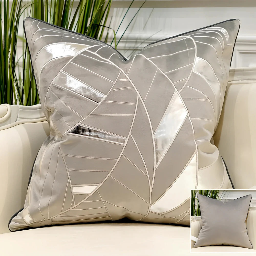Embroidered throw pillow with removable cover in plush fabric, showing detailed embroidery pattern