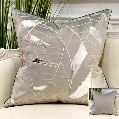 Embroidered throw pillow with removable cover in plush fabric, showing detailed embroidery pattern