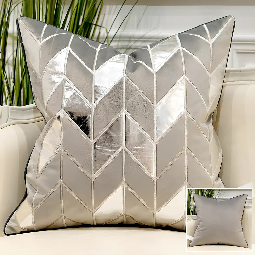 Embroidered throw pillow with removable cover in plush fabric, showing detailed embroidery pattern