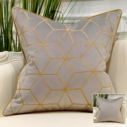 Embroidered throw pillow with removable cover in plush fabric, showing detailed embroidery pattern