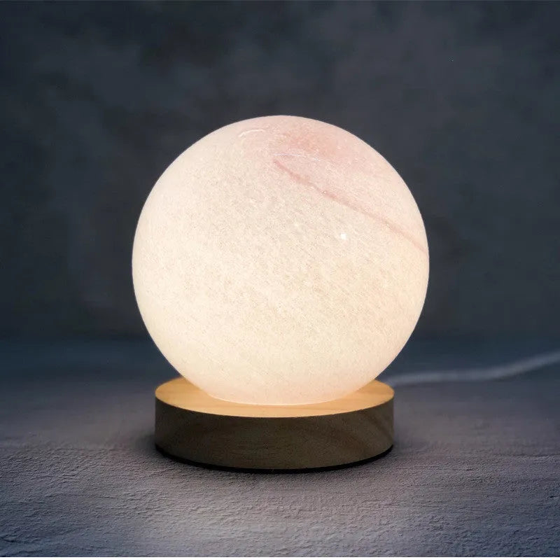 Nordic style table lamp with glass shade in choice of seven colours, USB-powered for bedside use