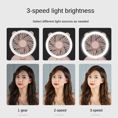 Portable USB-powered mini fan with LED fill light for taking selfies and videos in low-light conditions