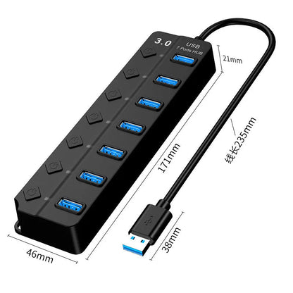 Black 7-port USB 3.0 hub with external power adapter on desktop