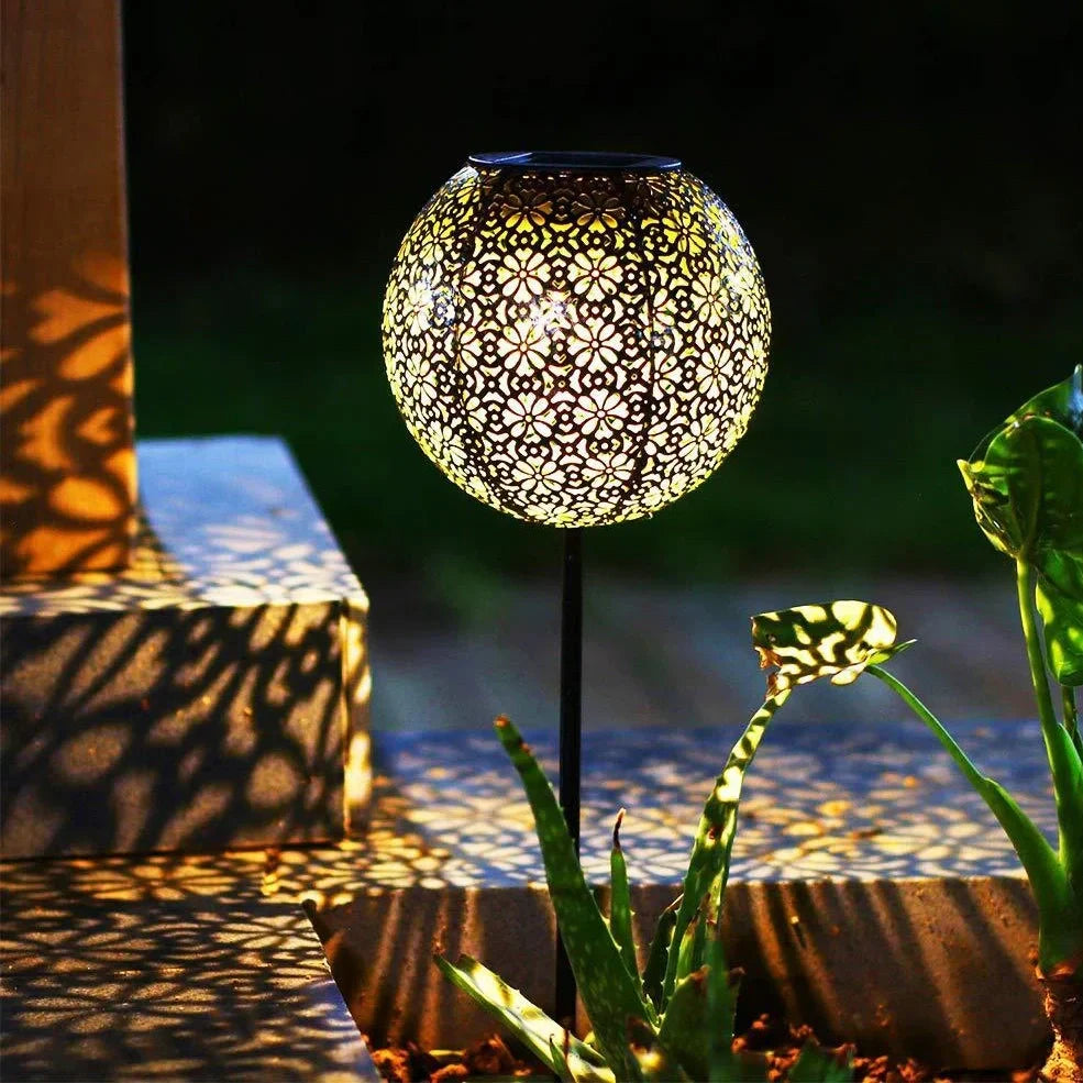 Solar wrought iron ground ball lamp with 15x15x46cm dimensions and LED lighting for garden pathways