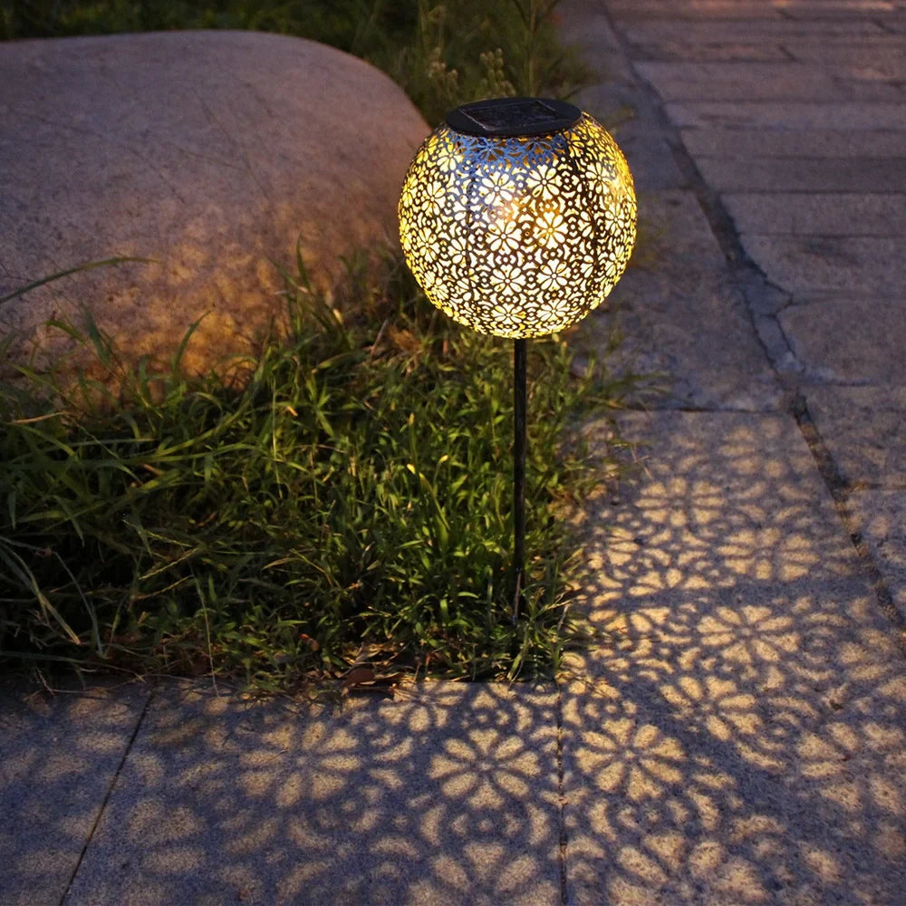 Solar wrought iron ground ball lamp with 15x15x46cm dimensions and LED lighting for garden pathways