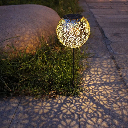 Solar wrought iron ground ball lamp with 15x15x46cm dimensions and LED lighting for garden pathways