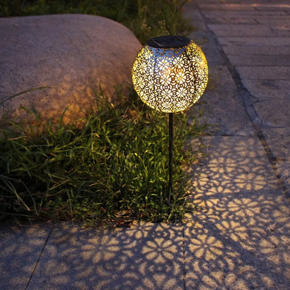 Solar wrought iron ground ball lamp with 15x15x46cm dimensions and LED lighting for garden pathways