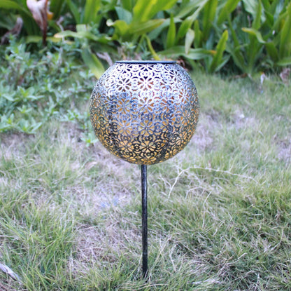 Solar wrought iron ground ball lamp with 15x15x46cm dimensions and LED lighting for garden pathways