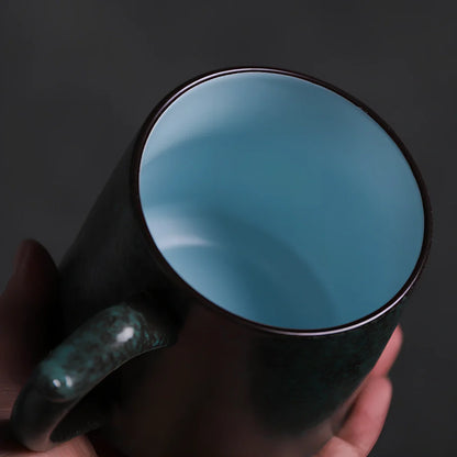 Modern ceramic mug holding 401-500ml in black, blue, or green, simple design for hot beverages
