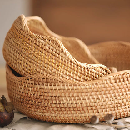 Hand-woven bamboo storage basket with natural weave pattern for fruit organisation