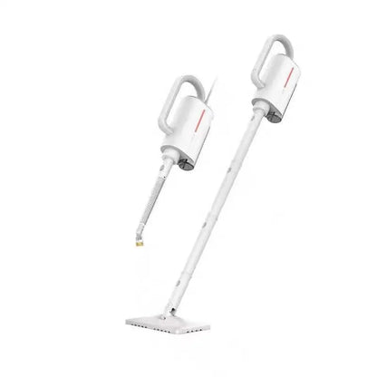 White Deerma handheld steam cleaner with multiple brush heads and extension tubes on a table