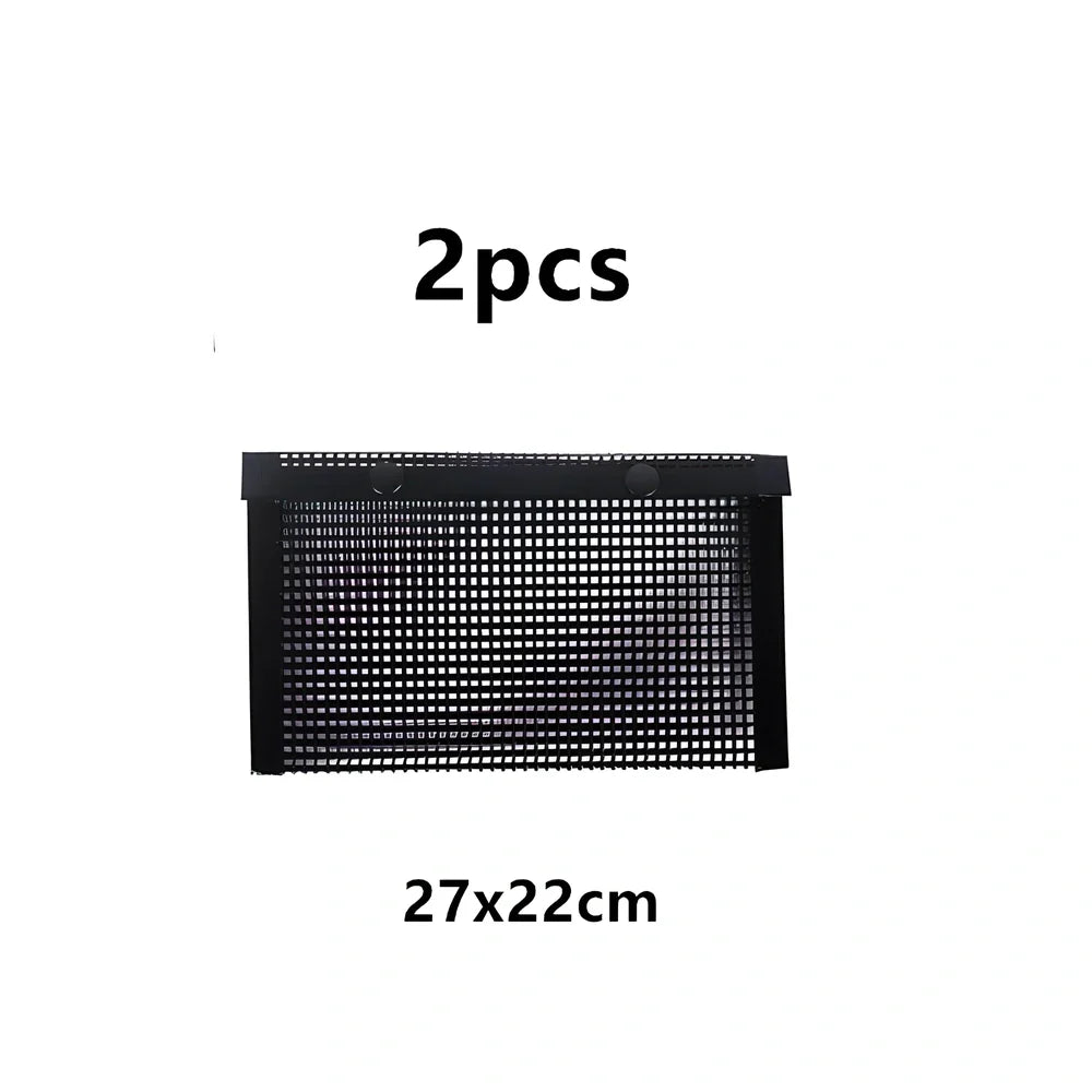 Black grill mesh bag with non-stick grid mat on barbecue, showing smoke circulation through mesh design