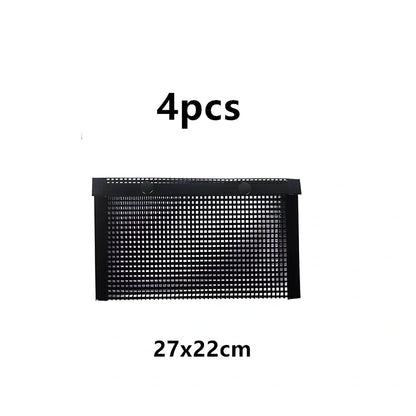 Black grill mesh bag with non-stick grid mat on barbecue, showing smoke circulation through mesh design