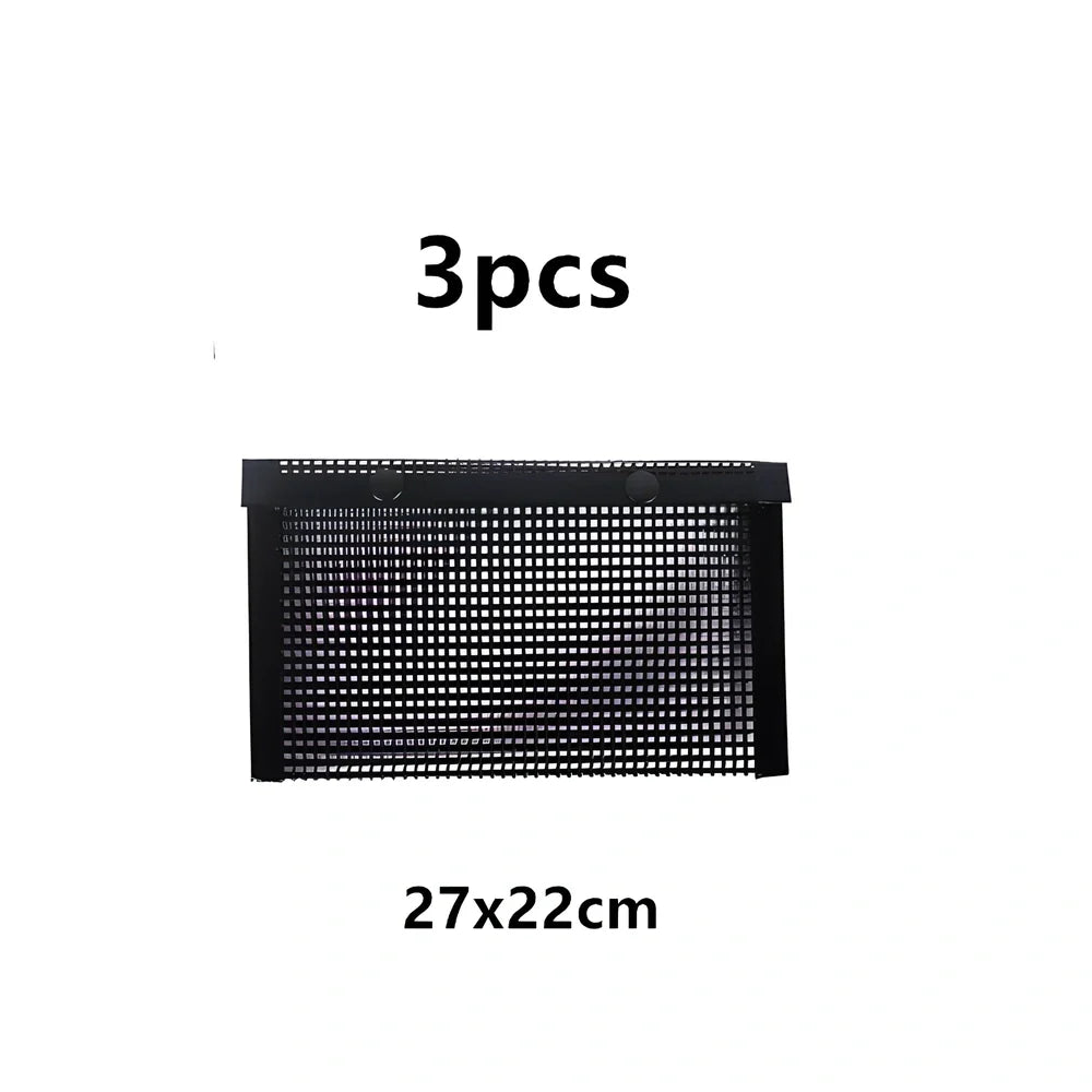 Black grill mesh bag with non-stick grid mat on barbecue, showing smoke circulation through mesh design