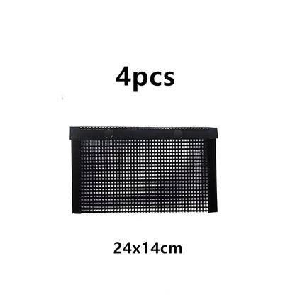 Black grill mesh bag with non-stick grid mat on barbecue, showing smoke circulation through mesh design