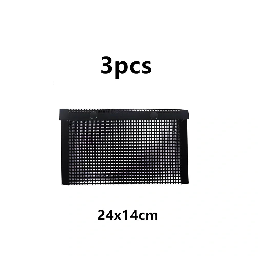 Black grill mesh bag with non-stick grid mat on barbecue, showing smoke circulation through mesh design