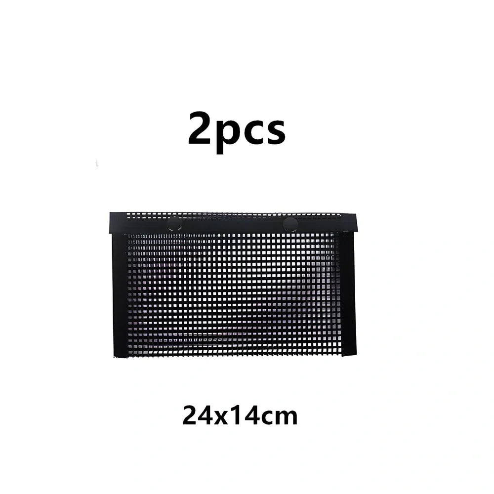Black grill mesh bag with non-stick grid mat on barbecue, showing smoke circulation through mesh design