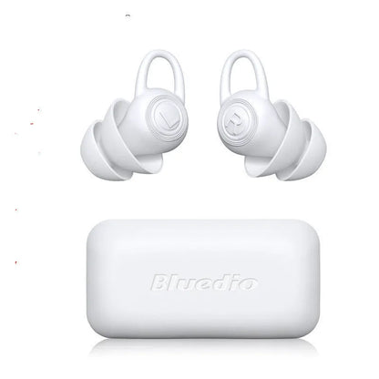 A single pair of white soft silicone ear plugs on a clean background.