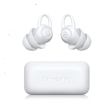 A single pair of white soft silicone ear plugs on a clean background.