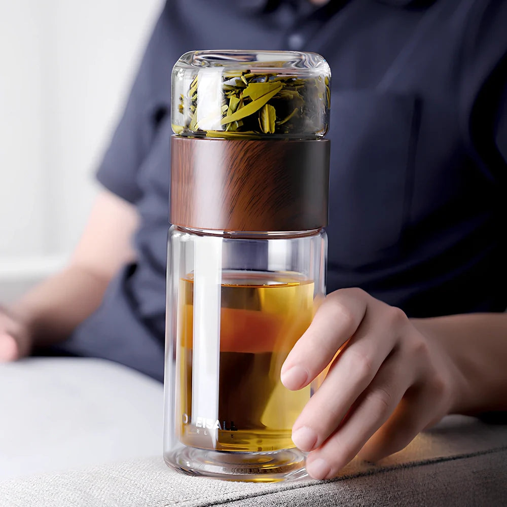 Wood grain separated tea cup with double-wall borosilicate construction and leak-proof lid showing measurement markings