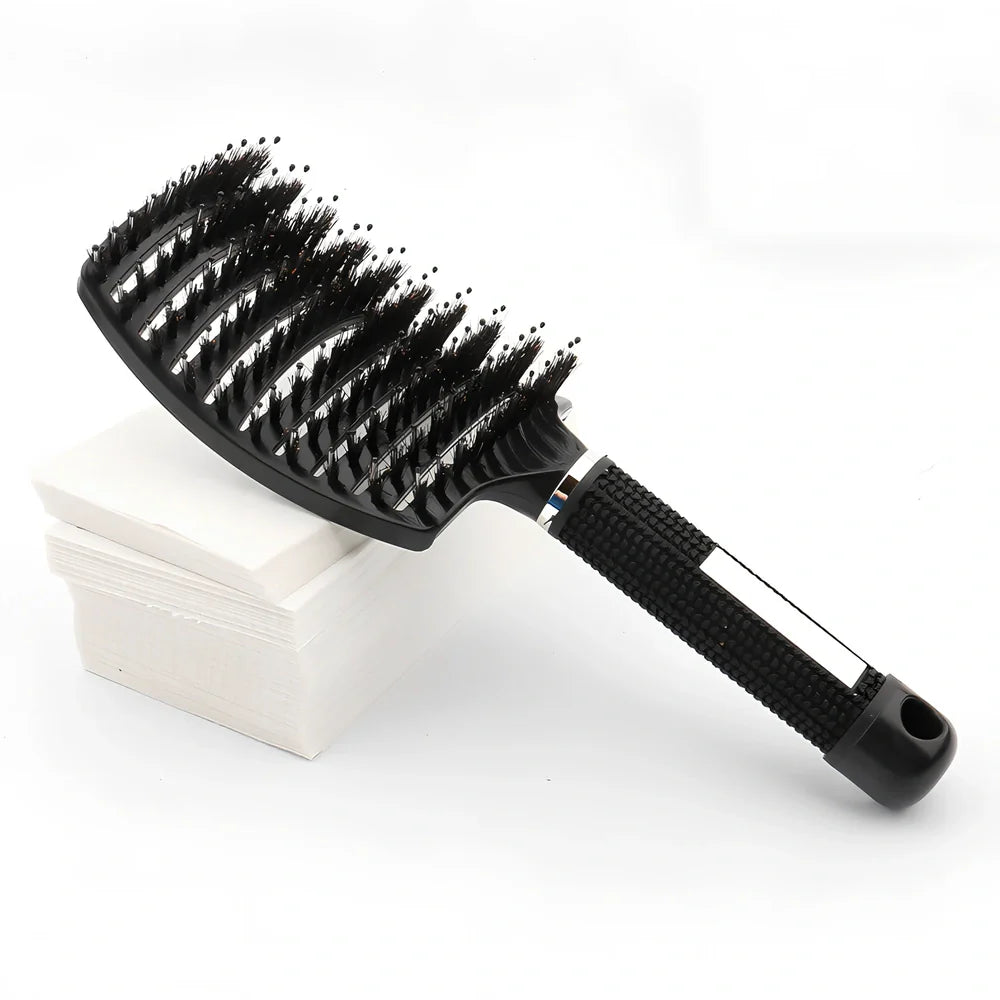 Large curved hairbrush with boar bristles showing 15cm width and natural bristle distribution
