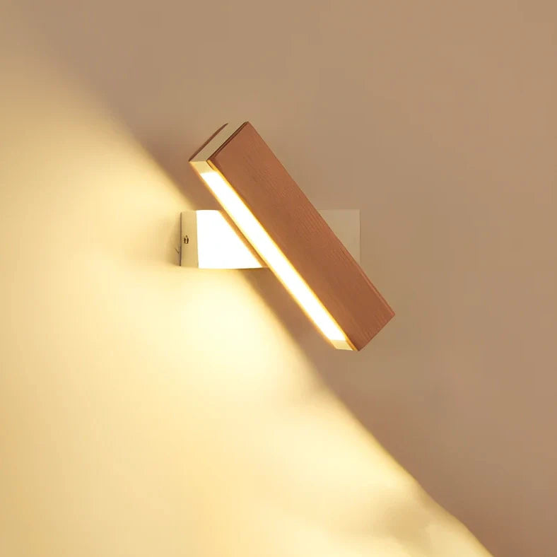 Adjustable wooden LED wall lamp in black finish with directional lighting bar for modern interiors
