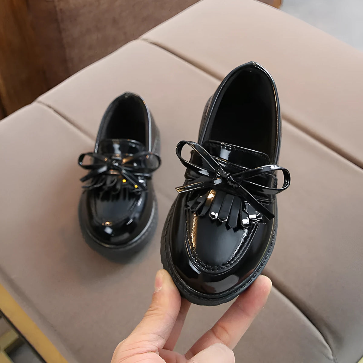 Children's vintage sneakers in black or brown with synthetic leather upper, rubber non-slip sole, and car suture detailing.