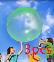 Large pink, yellow, green, and blue inflatable bouncy balls in various sizes for children's play.