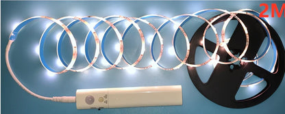 LED human induction bed lamp strip with remote control, 8mm width, showing yellow cut marks for custom length adjustment