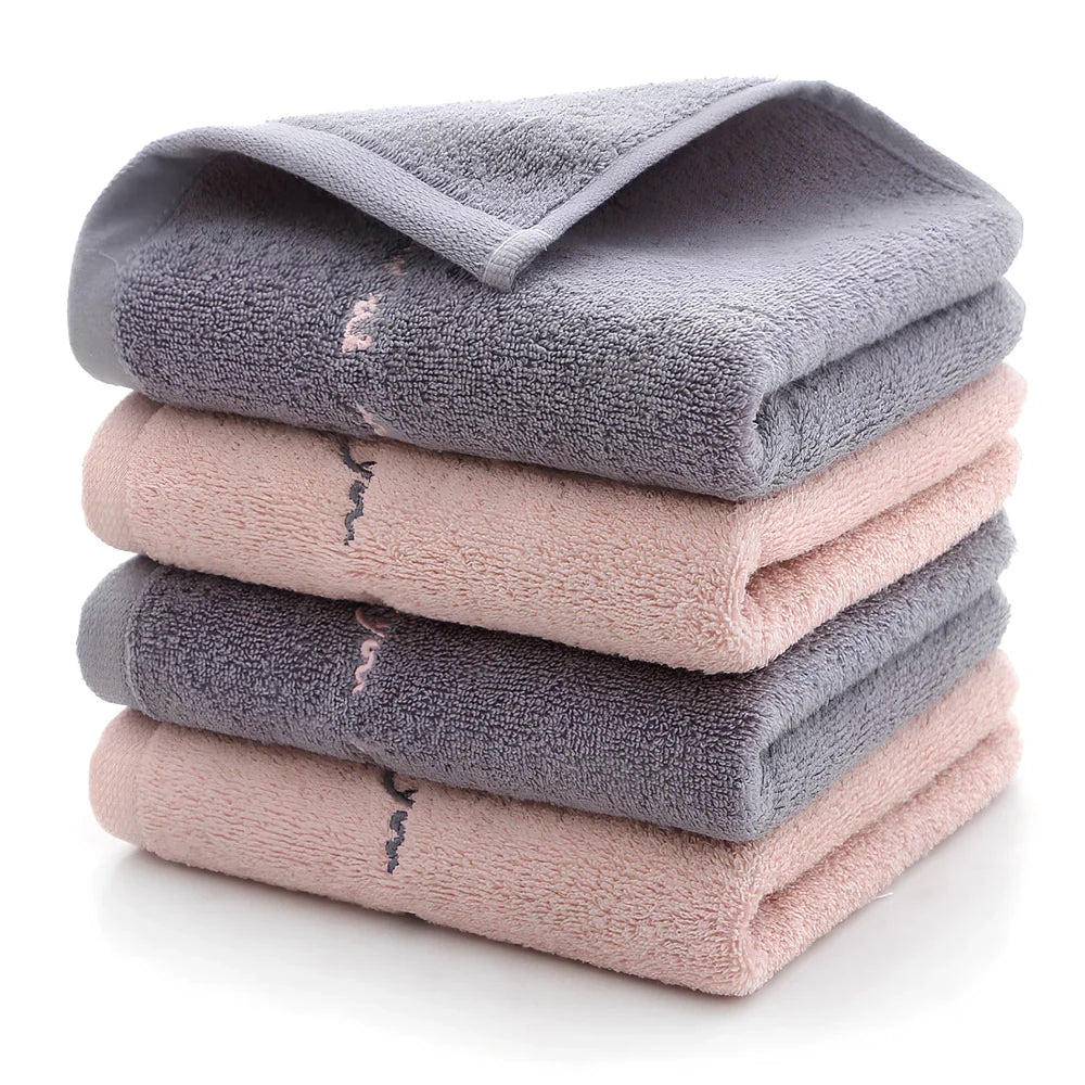 Long-staple cotton face wash towel with embroidery detailing measuring 74x34cm