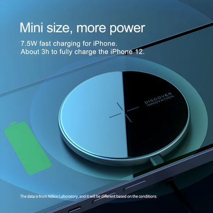 Black MagSlim magnetic wireless charging pad for phones on a table.