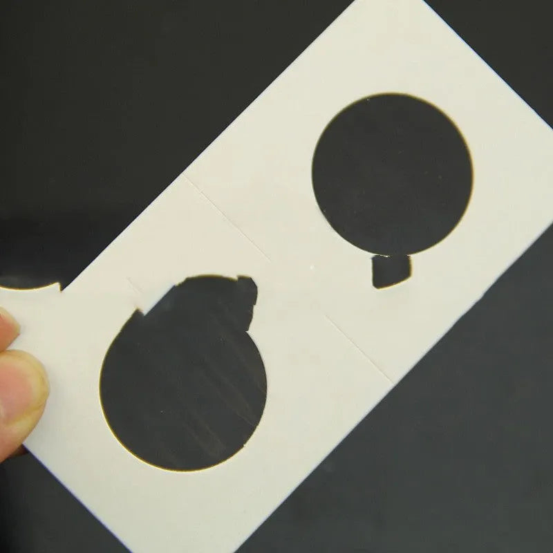 Set of 50 white paper coin protectors in transparent OPP packaging for commemorative coin storage