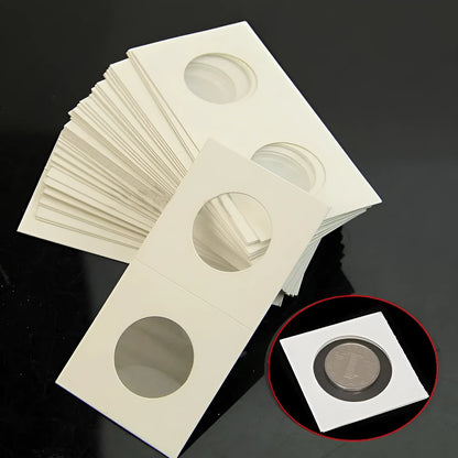Set of 50 white paper coin protectors in transparent OPP packaging for commemorative coin storage