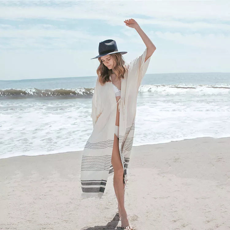 White cotton crochet knitted beach pareo dress with tassels, perfect for beach outings and casual wear