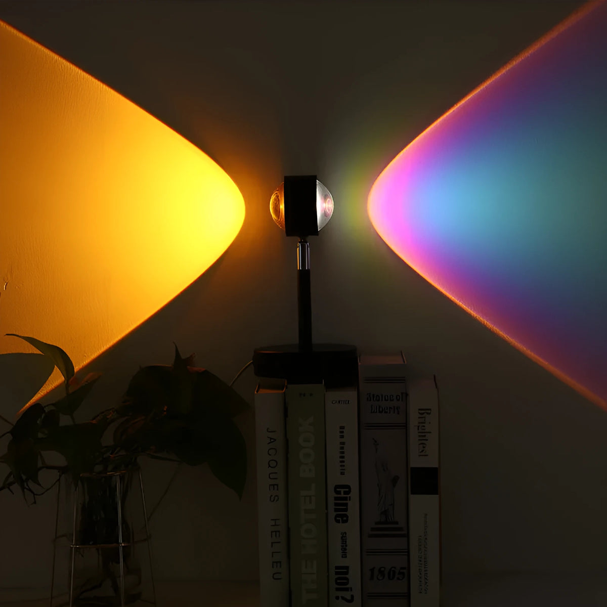 Black USB dual-head sunset rainbow projection lamp with touch controls on bedside table